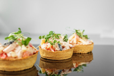 Delicious appetizer with tartlet and salad. Food, restaurant and event conceptの写真素材
