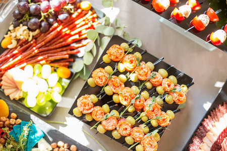 catering buffet table with different appetizers. Italian and french dishes.の写真素材