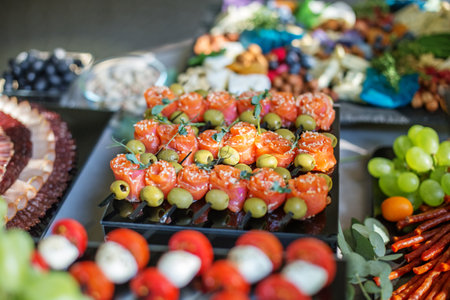 catering buffet table with different appetizers. Italian and french dishes.の写真素材