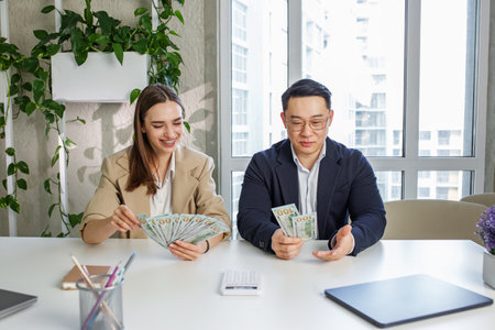 Money, gender bias and salary inequality in workplace between team of equal professional employee colleagues.の写真素材