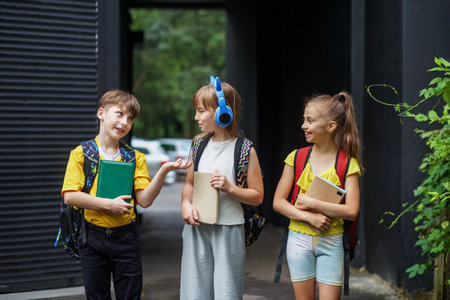 Back to school. Beginning of school lessons. Meeting friends. Concept of school, study, education, friendship, childhoodの写真素材
