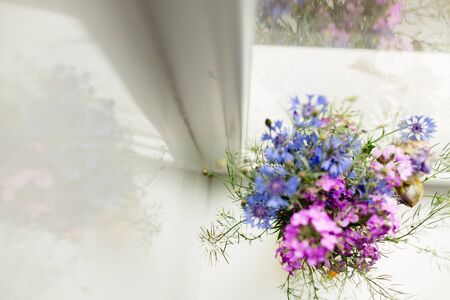Bright colorful summer flowers bouquet in the sunshineの写真素材