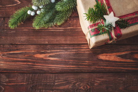 Christmas background with gift box and fir branches. Xmas and New Year theme. Space for text.の写真素材