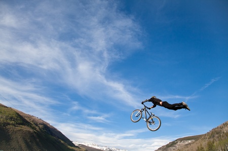 Vail, Colorado, USA - June 3rd 2011 - The Teva Mountain Games - Bike Slopestyle finale : bike jump, high in the air のeditorial素材