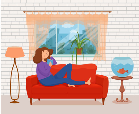 Young woman reading book sitting on the sofa. Colorful cartoon vector illustration of girl studying. Modern living room flat style interior with floor lamp, window, cat, aquarium fish, house plant.のイラスト素材