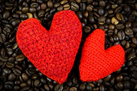 Two handmade hearts on coffee beansの写真素材
