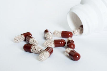 Pills spilling out of pill bottleの写真素材