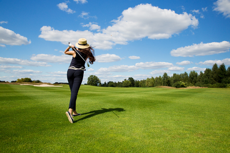 portrait of a young male golf player, back viewの写真素材