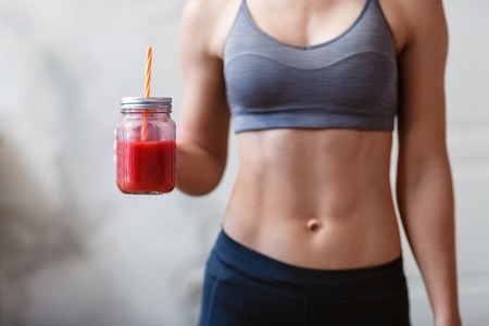 Fitness and healthy lifestyle concept with detox smoothie