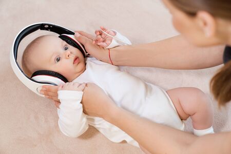 funny baby little boy in headphonesの写真素材