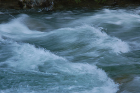 Waves of Italian river in Alpsの写真素材