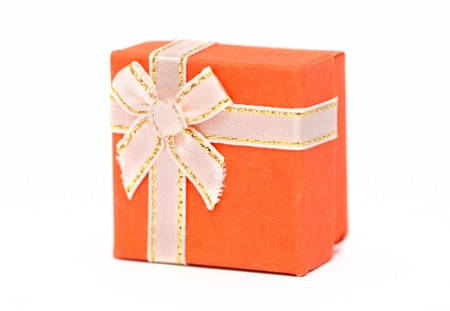 Orange gift-box isolated on whiteの写真素材