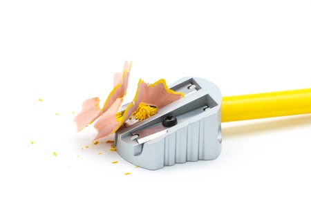 Pencil sharpener with yellow pencil and shavingsの写真素材
