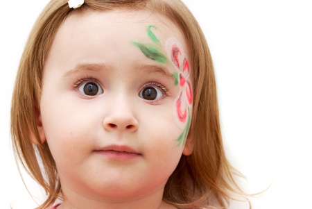 Adorable little girl with face-art isolated on whiteの写真素材