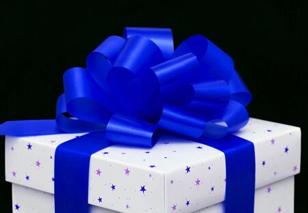 White gift box isolated on blackの写真素材