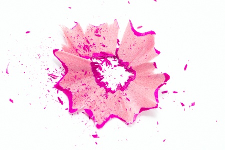 Purple pencil shavings isolated on whiteの写真素材
