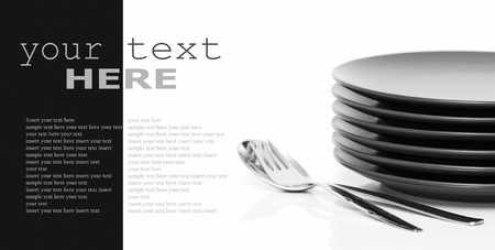 Stack of brown round plates with spoon and fork. Black and white image (with sample text)の写真素材