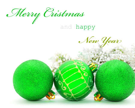 Christmas greeting card with green baubles and sample textの写真素材
