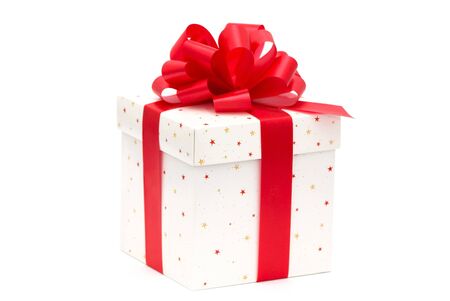 White gift box with red ribbon isolated on whiteの写真素材