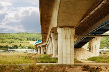 Curved highway construction from under the bridgeの写真素材