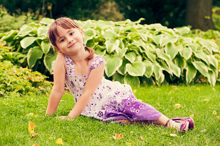 Portrait of adorable little girl with beautiful brown eyesの写真素材