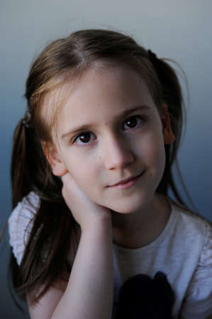 Close up portrait of adorable young firl. Looking at camera.の写真素材
