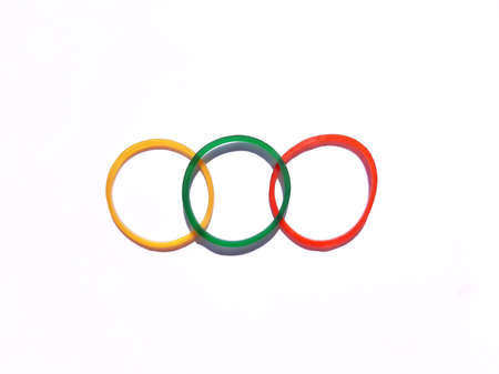 Arrangement of three color elastic rubber bands overlap each other in a row on white background....