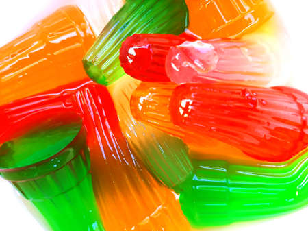 Colorful carrageenan jelly in white bowl with water - full frame