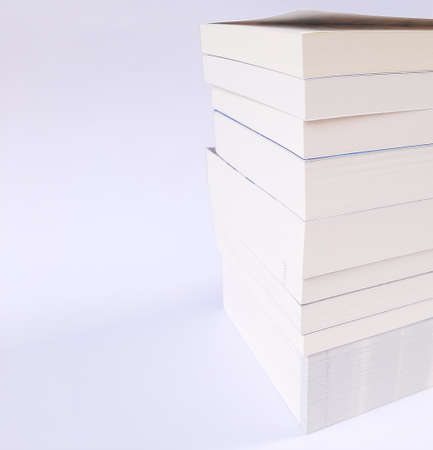 Stack of books on white background - copy space