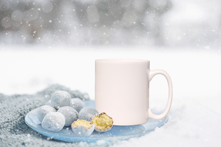 White Mug Mockup - Winter theme. Perfect for businesses selling mugs, just overlay your quote or design on to the image.の写真素材