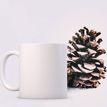 Winter styled white blank coffee mug to add custom design or quote. Perfect for businesses selling mugs, just overlay your quote or design on to the image.の写真素材