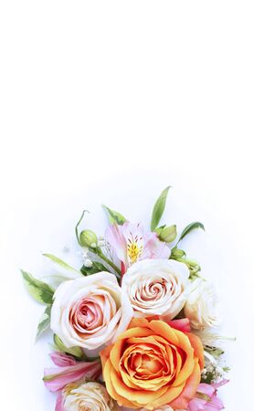 Delicate floral arrangement of cream roses and pink astromelias. Background for greetings, invitations to a holiday, wedding, engagement.の写真素材