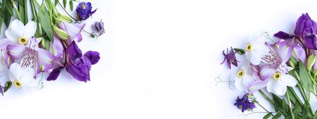 Spring flower arrangement - white daffodils, lilac Alstroemeria, purple irises on a white background. Background for greetings, invitations, and postcards.の写真素材