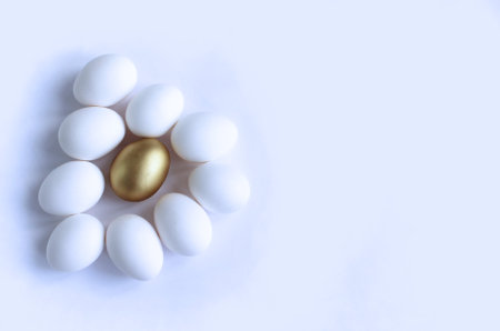 Golden egg on white background with copy space. Happy easter concept.の写真素材