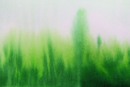 Abstract watercolor painted background on paper texture with green grass and treesの写真素材