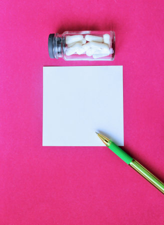 Empty paper with pen on pink background