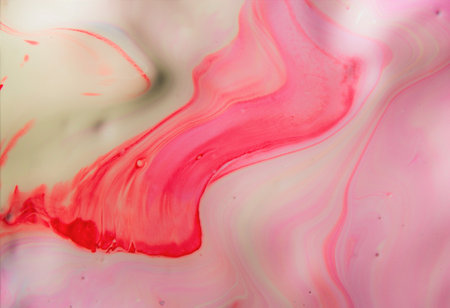 abstract red and pink background from oil paint on water surface.の写真素材
