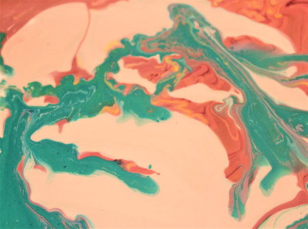 Abstract background of acrylic paint in pink and green tones. Liquid marble pattern.