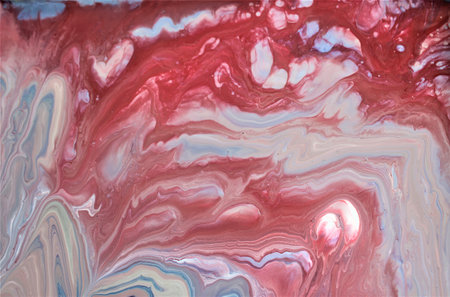 Abstract background of acrylic paint in red and blue tones. Liquid marble pattern.