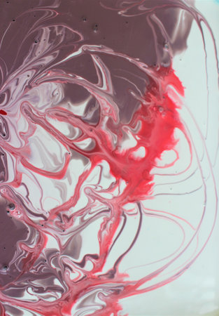 abstract background of red and black acrylic paint in water closeup