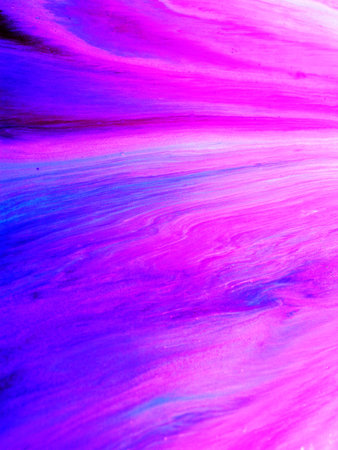 Abstract background of acrylic paint in blue and purple tones, macro photography