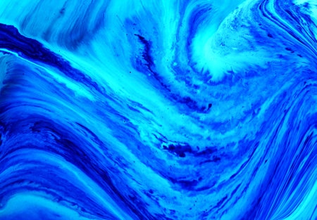 Abstract background of acrylic paint in blue tones. Liquid acrylic texture.
