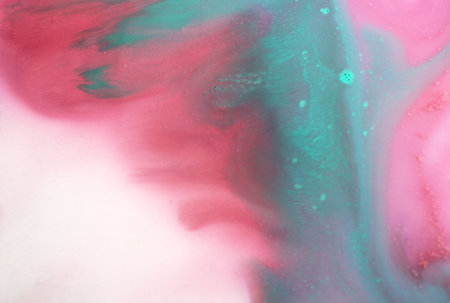 Abstract background of acrylic paint in pink, blue and green colors.