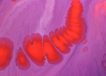 Abstract background of acrylic paint in red and pink tones. Macro photoの写真素材