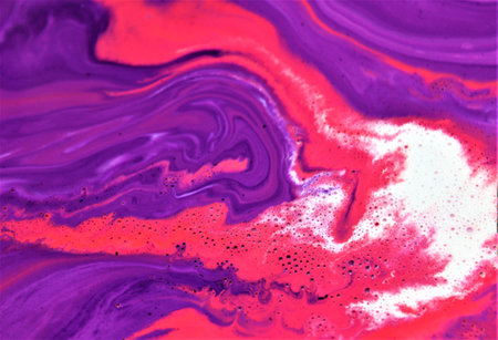Abstract background of acrylic paint in pink and purple tones. Liquid marble texture.