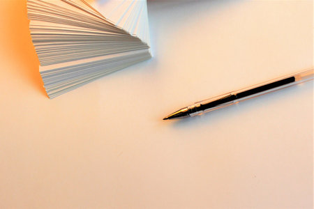 Pen and notebook on a white background. Top view. Copy space.