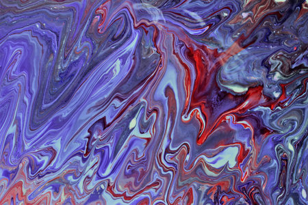 Abstract background of acrylic paint in blue and red tones. Liquid marble pattern.
