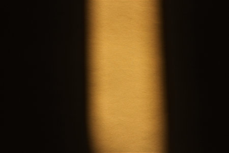 Light from the window on a dark background. Selective focus.の写真素材