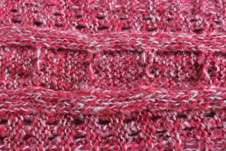 Knitted wool texture. Handmade knitting wool background. Red and white yarn.