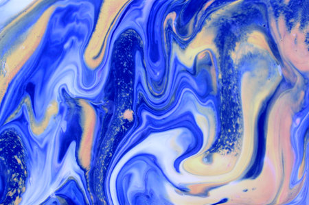 Blue and yellow abstract background of acrylic paint in the style of marbling